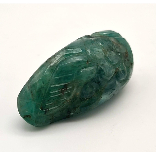 538 - A natural freeform carved emerald (58.85 carats) with GLA certificate. Dimensions: 35.45 x 16.11 x 1... 