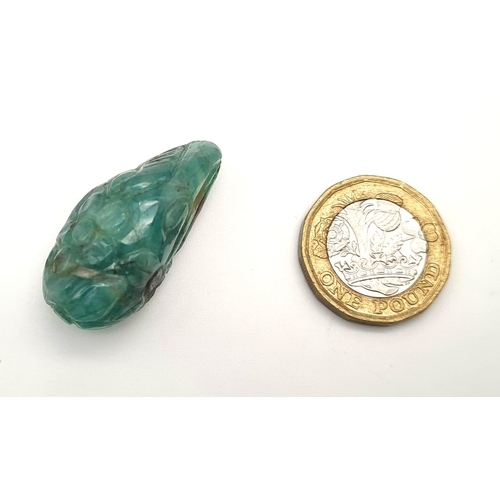 538 - A natural freeform carved emerald (58.85 carats) with GLA certificate. Dimensions: 35.45 x 16.11 x 1... 