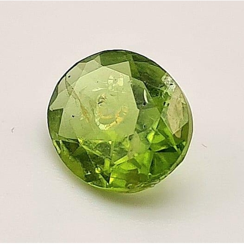 589 - An oval cut peridot (3.15 carats) with GLA certificate. Dimensions:10.60 x 8.71 x 4.62 mm. Original ... 