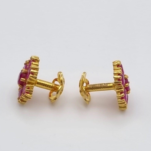 109 - A Mixed Gold Lot: A pair of 22k yellow gold earrings with red stones - 3.2g, a 22k yellow gold two b... 