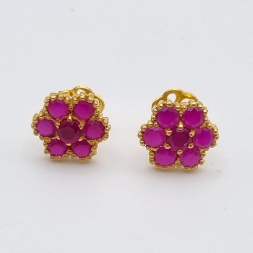 109 - A Mixed Gold Lot: A pair of 22k yellow gold earrings with red stones - 3.2g, a 22k yellow gold two b... 