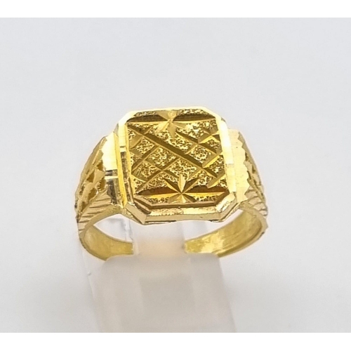 46 - A 22K Yellow Gold Signet Ring. Pierced and engraved decoration. Size V. 9.1g. Ref - 9212. Ring sligh... 