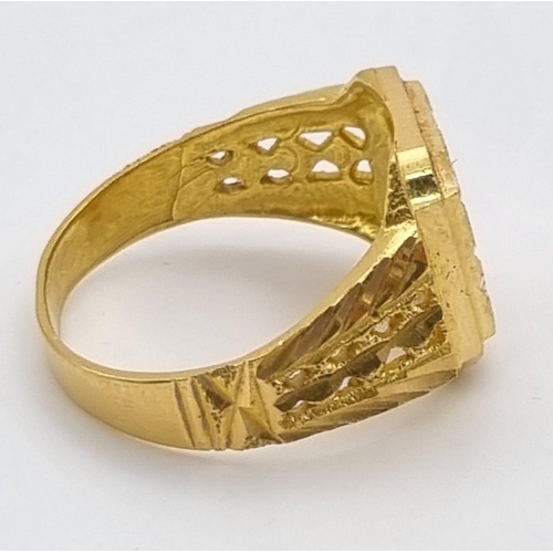 46 - A 22K Yellow Gold Signet Ring. Pierced and engraved decoration. Size V. 9.1g. Ref - 9212. Ring sligh... 