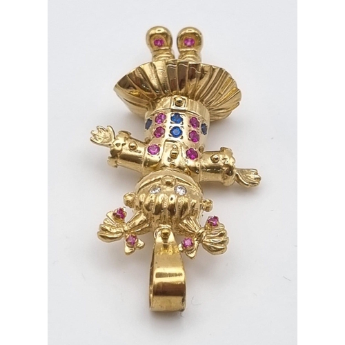 5 - A 9k Yellow Gold Multi-Coloured-Stone Doll Pendant. 5.5cm including attachment. 11.83g total weight.... 