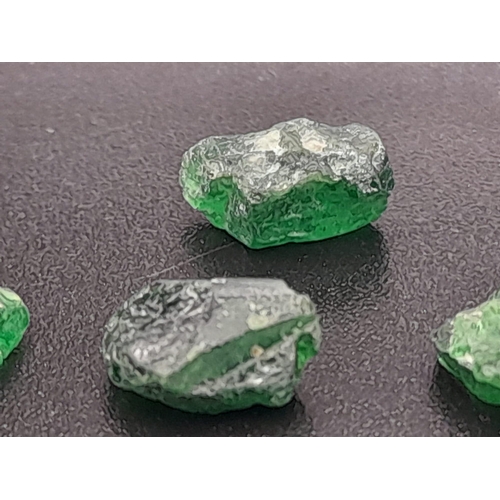 596 - Four rough dioptase pieces (total 6.30 carats) with GLA certificate. Average dimensions: 8.10 x 5.90... 