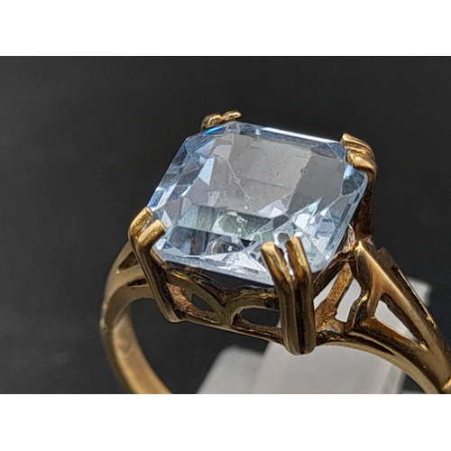 642 - A 9K Yellow Gold Blue Topaz Ring. Size J. 2.15g.