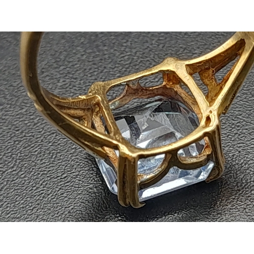 642 - A 9K Yellow Gold Blue Topaz Ring. Size J. 2.15g.