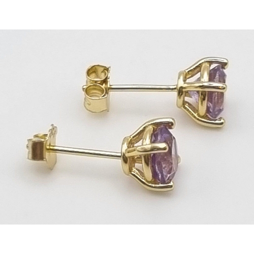 986 - A Pair of 925 Silver Gilded Amethyst Earrings.