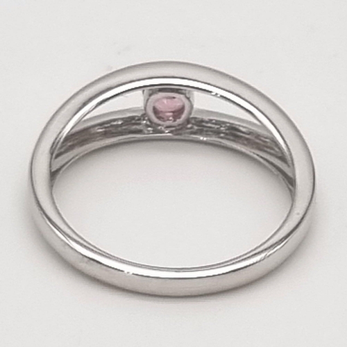 16 - An 18K White Gold 0.20ct Torsion Set Pink Tourmaline Ring. Elegant and very modern, this solitaire r... 