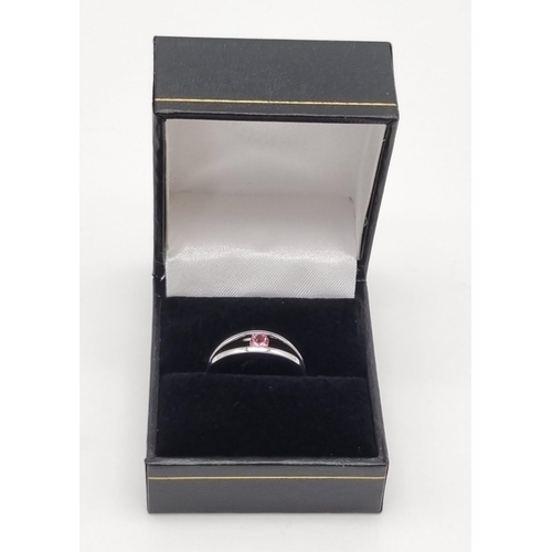 16 - An 18K White Gold 0.20ct Torsion Set Pink Tourmaline Ring. Elegant and very modern, this solitaire r... 