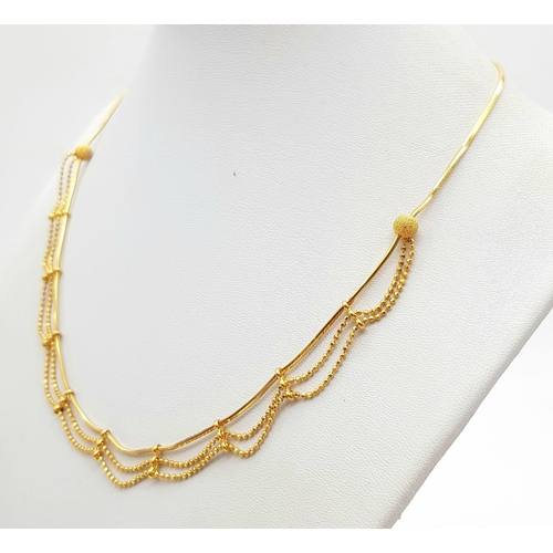 209 - A 22K Yellow Gold Necklace with a Three-Row Drop Effect. 42cm. 11.52g. Ref - 9091. a/f.