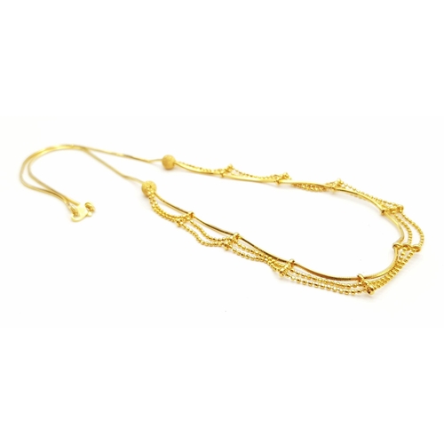 209 - A 22K Yellow Gold Necklace with a Three-Row Drop Effect. 42cm. 11.52g. Ref - 9091. a/f.