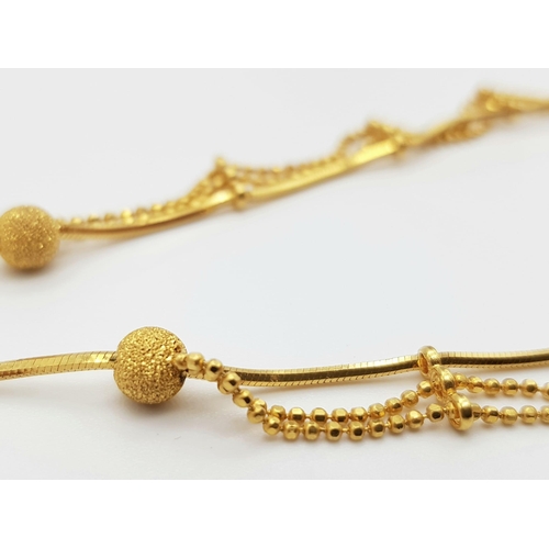 209 - A 22K Yellow Gold Necklace with a Three-Row Drop Effect. 42cm. 11.52g. Ref - 9091. a/f.