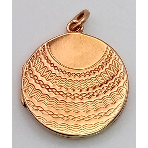 422 - A 9K Yellow Gold Locket Pendant. 17mm diameter. 3.04g