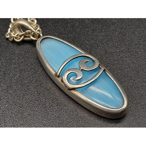 691 - A Vintage Sterling Silver and Turquoise Celtic Style Pendant Necklace 3cm long on 46cm chain