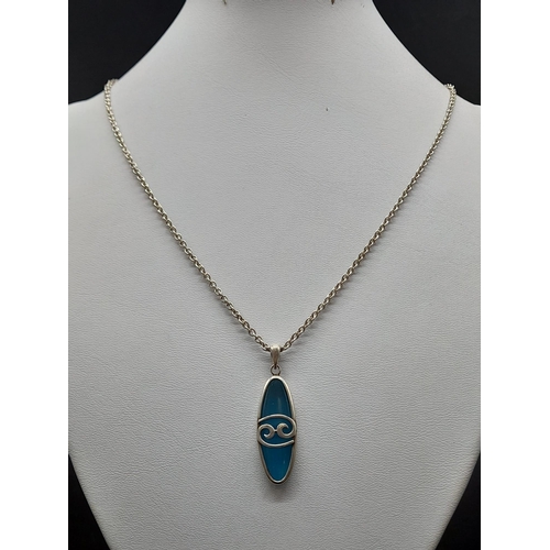 691 - A Vintage Sterling Silver and Turquoise Celtic Style Pendant Necklace 3cm long on 46cm chain