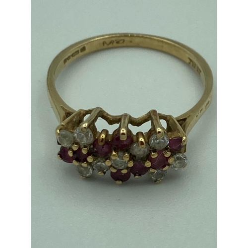 113 - 9 carat GOLD RING set with RUBIES and white Gemstones. Full UK hallmark. Complete with ring box.
 1.... 