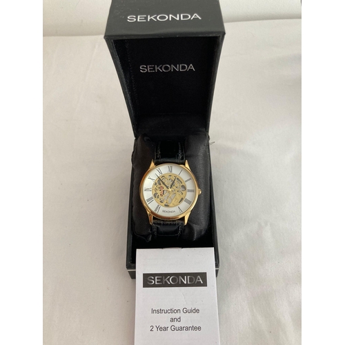 120 - Gentlemans quartz SEKONDA SKELETON WRISTWATCH in gold tone,, having large face with black digits and... 