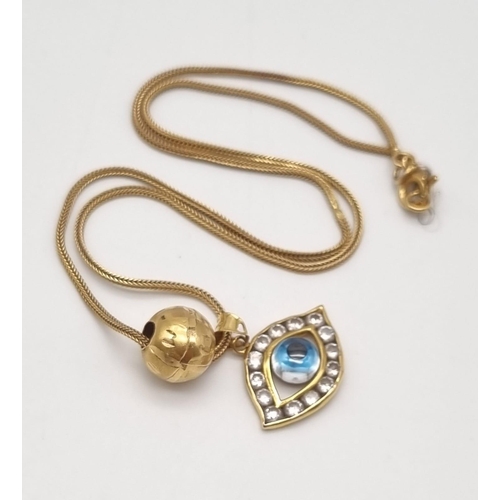 179 - A 21K Yellow Gold Blue-Eye Pendant and Necklace with a 21K Yellow Gold Pair of pierced and filigree ... 