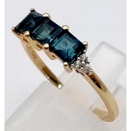 362 - A 10K Yellow Gold Blue Tourmaline and Diamond Ring. Three square cut tourmalines with diamonds eithe... 