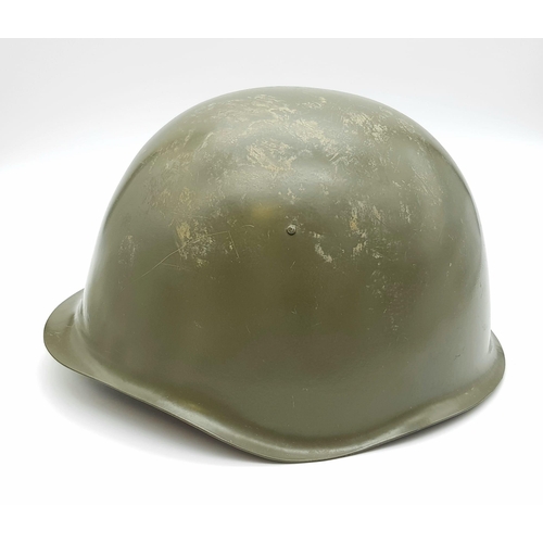 428 - A 1980s Soviet Army Hard Steel Helmet. Leather strap and inner.