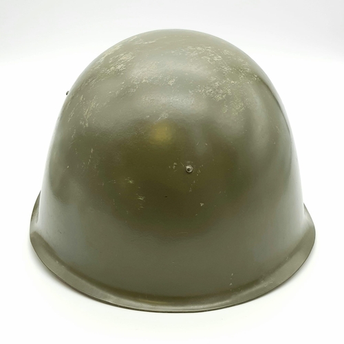 428 - A 1980s Soviet Army Hard Steel Helmet. Leather strap and inner.