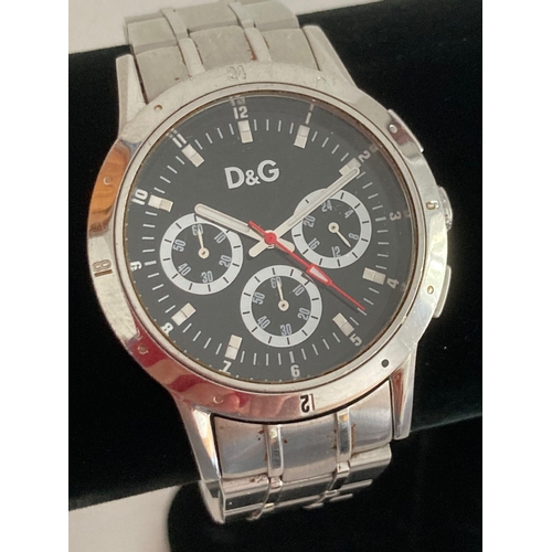 50 - Gentlemans Quartz D&G Chronograph, Multi dial black face model having sweeping red second hand. Silv... 