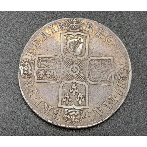 262 - A 1711c Queen Anne Shilling Silver Coin. 3rd bust. VF condition. Spink - 3610. Please see photos.