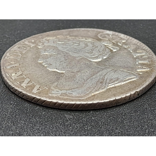 262 - A 1711c Queen Anne Shilling Silver Coin. 3rd bust. VF condition. Spink - 3610. Please see photos.