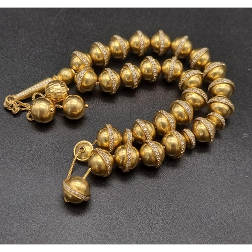 382 - 18K Gold & Diamond worry beads. (6ct approx)