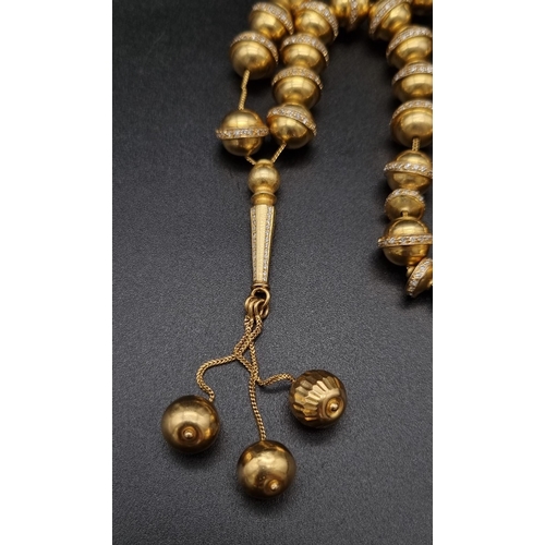 382 - 18K Gold & Diamond worry beads. (6ct approx)