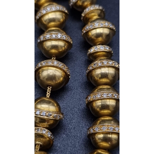 382 - 18K Gold & Diamond worry beads. (6ct approx)