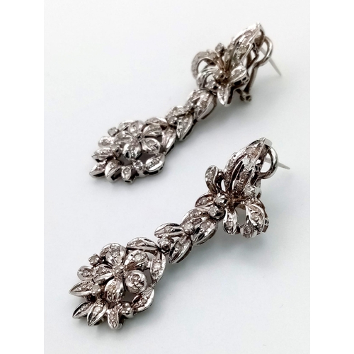 493 - 12K diamond drop earrings. 15.88 grams total weight. 5cm.