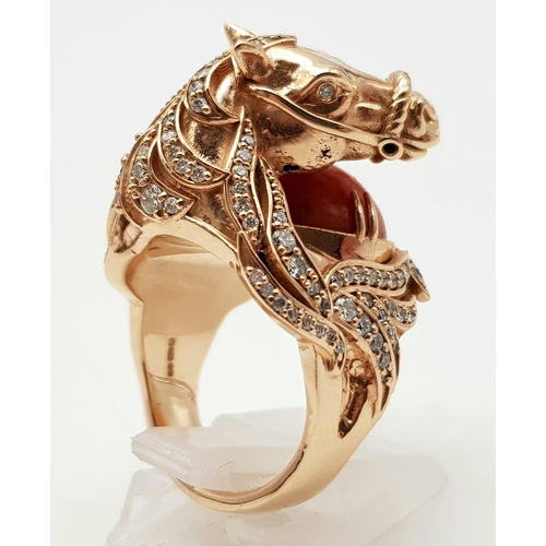 507 - An 18K Yellow Gold Natural Coral & Diamond Horse Figure Ring. 25.36g total weight. Size L 1/2.