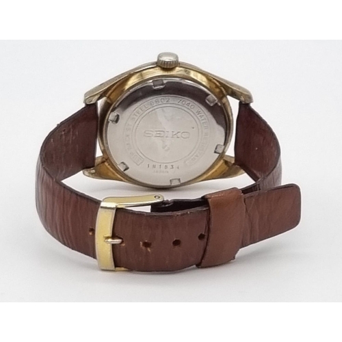 341 - Vintage 1970's Seiko watch, 17 jewels, date window, brown 22cm leather strap, in working order.