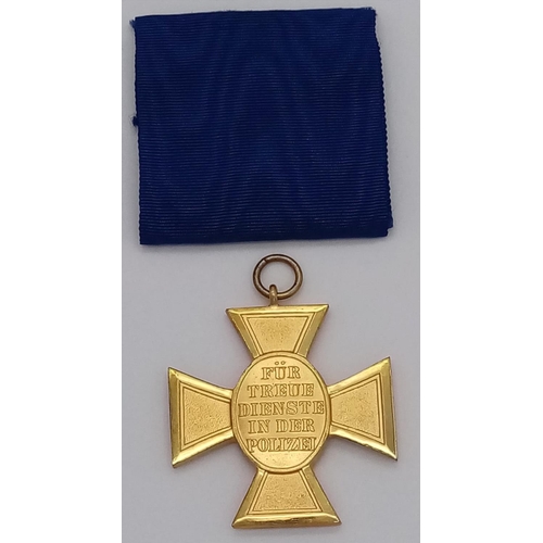 88 - A German Reich's Police 25 Year Long Service Medal.  This is a gilt cross depicting the German Reich... 