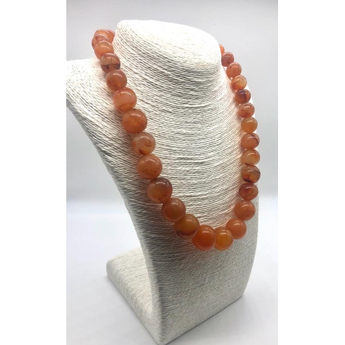 187 - An Autumn Fire Graduated Onyx Bead Necklace. Largest bead 20mm. 46cm necklace length.