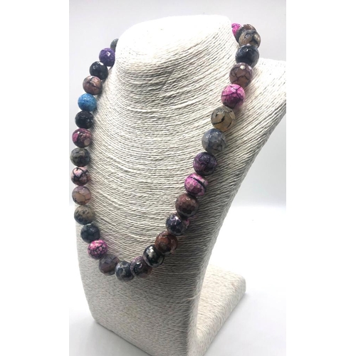 214 - A Multi-Coloured Dragons Vein Agate Bead Necklace. 12mm beads. 44cm necklace length.