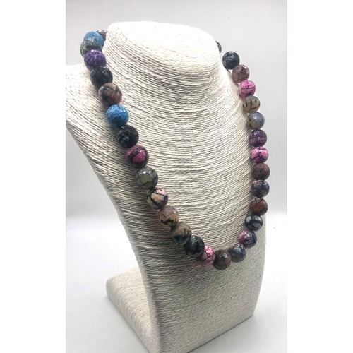 214 - A Multi-Coloured Dragons Vein Agate Bead Necklace. 12mm beads. 44cm necklace length.