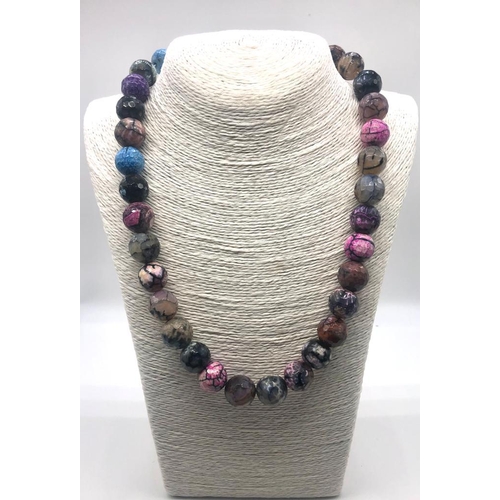 214 - A Multi-Coloured Dragons Vein Agate Bead Necklace. 12mm beads. 44cm necklace length.