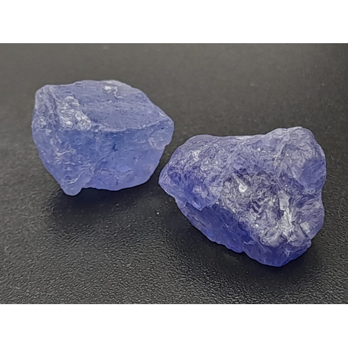 328 - Two rough tanzanite pieces (total 15.45 carats) with GLA certificate. Average dimensions: 13.80 x 9.... 