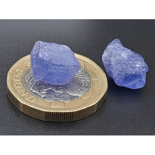 328 - Two rough tanzanite pieces (total 15.45 carats) with GLA certificate. Average dimensions: 13.80 x 9.... 