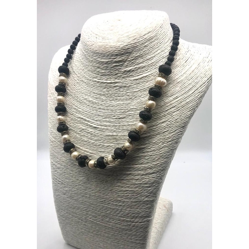 339 - A Freshwater Pearl and Lava Bead Necklace. Sparkly rondelles. 46cm necklace length.