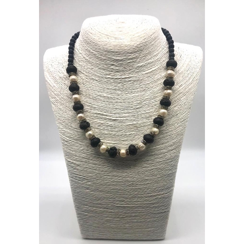 339 - A Freshwater Pearl and Lava Bead Necklace. Sparkly rondelles. 46cm necklace length.