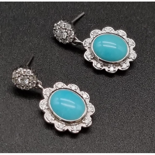 367 - 18K Natural turquoise and diamond set.
Ring: 5.36g, size M
Earrings: 9.00 grams total, length: 2.3cm... 