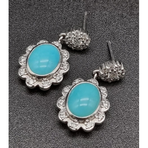 367 - 18K Natural turquoise and diamond set.
Ring: 5.36g, size M
Earrings: 9.00 grams total, length: 2.3cm... 