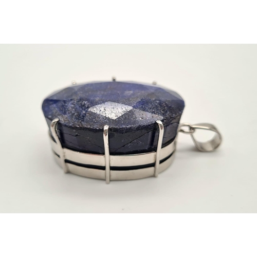 397 - A sterling silver pendant with a huge oval cut blue sapphire. Dimensions: 54 x 38 x 24 mm, weight: 1... 