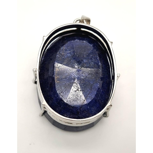 397 - A sterling silver pendant with a huge oval cut blue sapphire. Dimensions: 54 x 38 x 24 mm, weight: 1... 