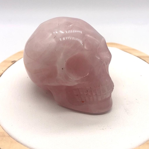 478 - A Rose Quartz Skull Figure. 4 x 5cm.