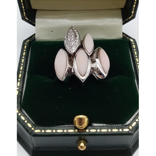 572 - An 18K White Gold Pearl and Diamonds Five-Oval Ring. Size N. 14.56g total weight.